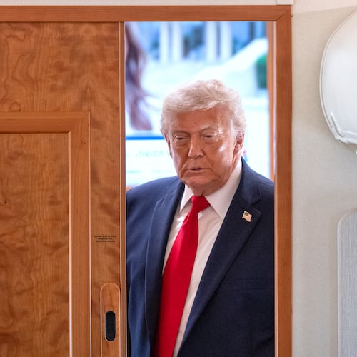 President Donald Trump arrives to speak to reporters aboard Air Force One en route from Joint Base Andrews, Md., to Eau Claire, Wis., Friday, June 5, 2026. (AP Photo/Mark Schiefelbein)