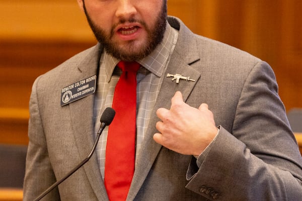 State Sen. Colton Moore, R-Trenton, points to his AR-15 pin while speaking on SB 163, a gun bill he sponsored, in the Senate at the Capitol in Atlanta on Crossover Day, Thursday, March 6, 2025. (Arvin Temkar / AJC)