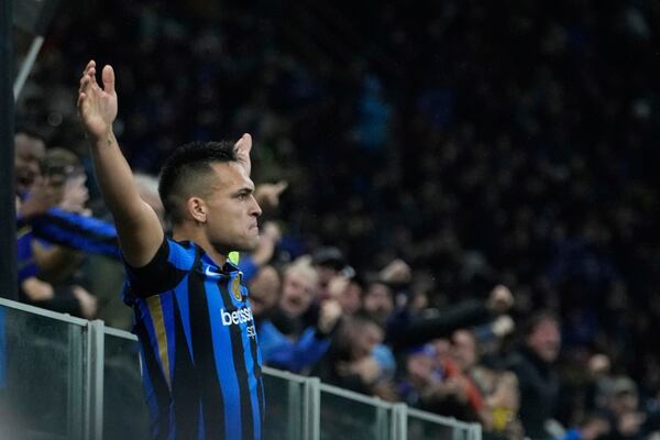 Inter Milan's Lautaro Martinez celebrates after scoring his side's opening goal during the Champions League quarterfinal second leg soccer match between Inter Milan and Bayern Munich at the San Siro stadium in Milan, Italy, Wednesday, April 16, 2025. (AP Photo/Luca Bruno)
