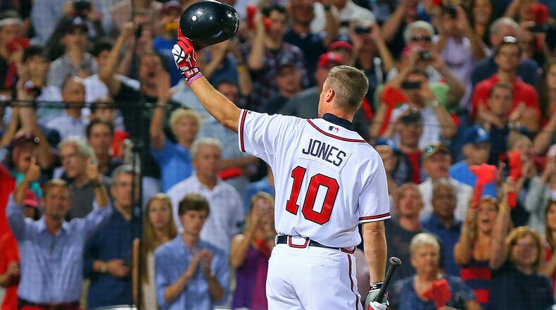 Chipper Jones tips his batting helmet to the fans as he takes the plate for the final at-bat of his career during the 9th inning in the National League wild card game Friday, Oct. 5, 2012, at Turner Field in Atlanta.