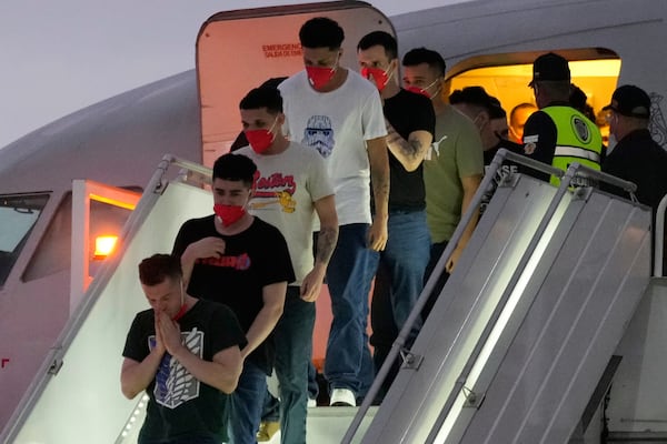 Migrants deported months ago by the United States to El Salvador under the Trump administration's immigration crackdown arrive at Simon Bolívar International Airport in Maiquetia, Venezuela, Friday, July 18, 2025. (AP Photo/Ariana Cubillos)