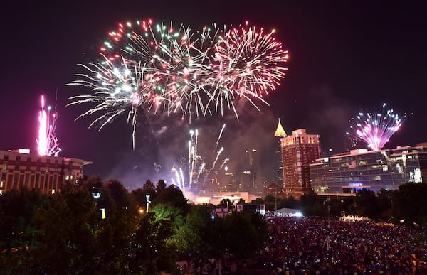 Fireworks light up the downtown Atlanta skyline during Centennial Olympic Park's Fourth of July Celebration on Monday, July 4, 2016. (HYOSUB SHIN / HSHIN@AJC.COM)