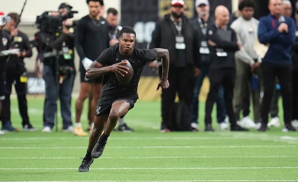 Colorado wide receiver Travis Hunter takes part in passing drills during the team's NFL football pro day Friday, April 4, 2025, in Boulder, Colo. (AP Photo/David Zalubowski)