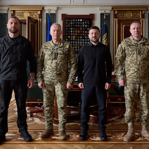 In this photo provided by the Ukrainian Presidential Press Office, from left, acting Minister of Defense Major General Yevhen Khmara, former Commander-in-Chief of the Ukrainian Armed Forces Oleksandr Syrskyi, Ukrainian President Volodymyr Zelenskyy and new commander-in-chief of Ukraine's Armed Forces Mykhailo Drapatyi, pose for a photo during their meeting in Kyiv, Ukraine, Wednesday, July 22, 2026. (Ukrainian Presidential Press Office via AP)