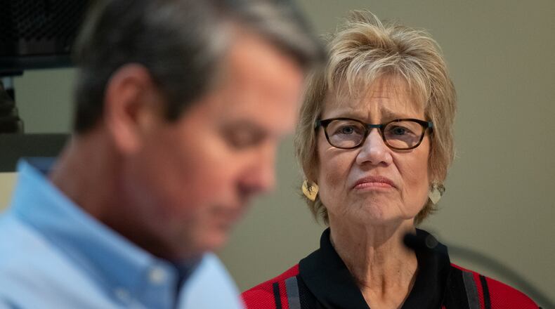 Dr. Kathleen Toomey, Georgia’s public health commissioner, listens as Gov. Brian Kemp answers a question during a news conference Wednesday. Kemp extended a shelter-at-home order to deal with the coronavirus pandemic to the end of the month. Ben@BenGray.com for The Atlanta Journal-Constitution