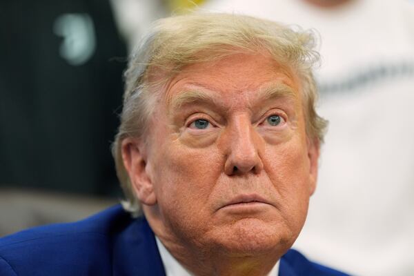 President Donald Trump talks with reporters as he meets with members of the Juventus soccer club in the Oval Office of the White House, Wednesday, June 18, 2025, in Washington. (AP Photo/Alex Brandon)