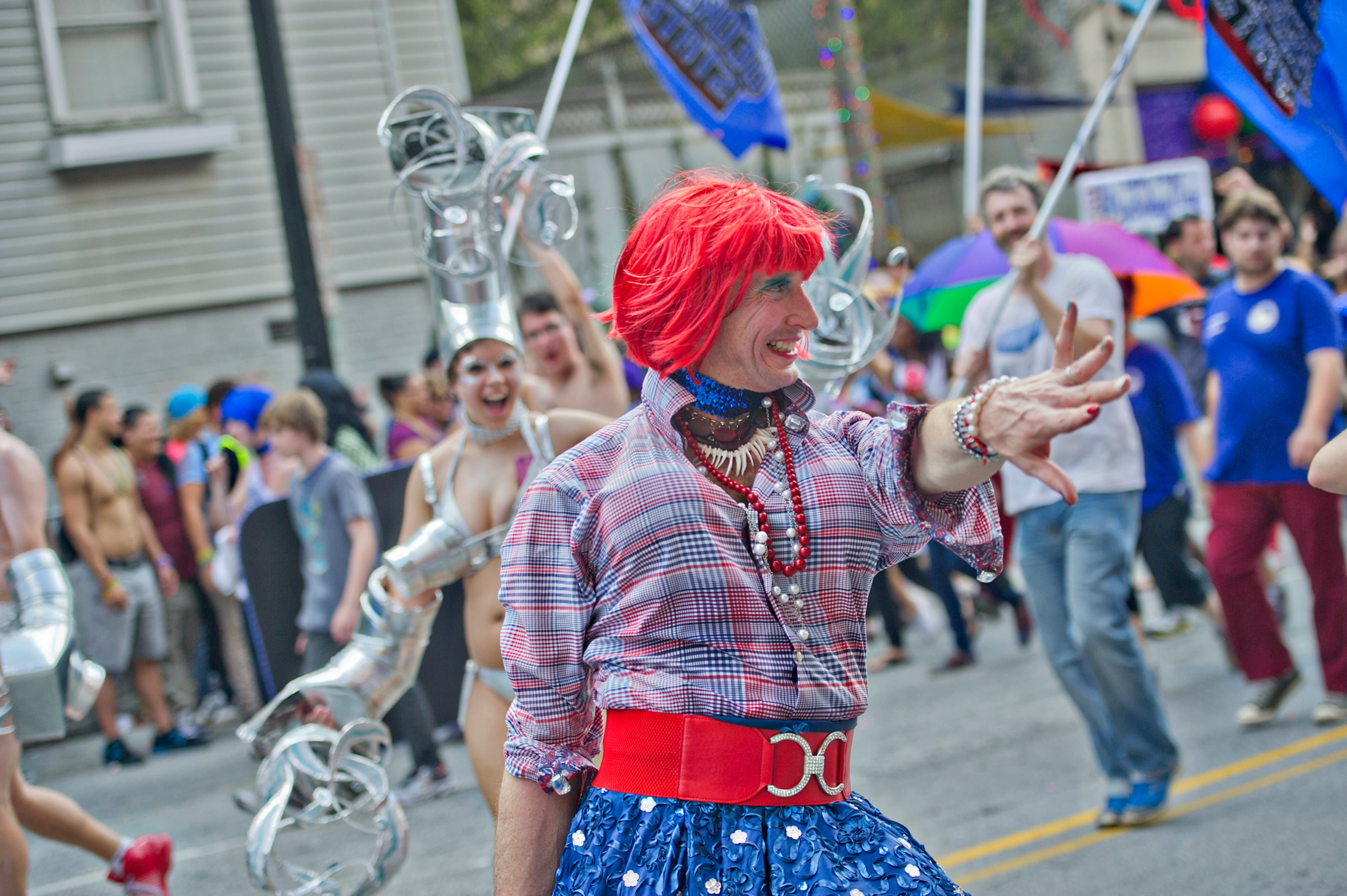 Tony Bayles (center) plays to the crowd as he marches down 10th Street during the Atlanta Pride Parade on Sunday, October 12, 2014. JONATHAN PHILLIPS / SPECIAL