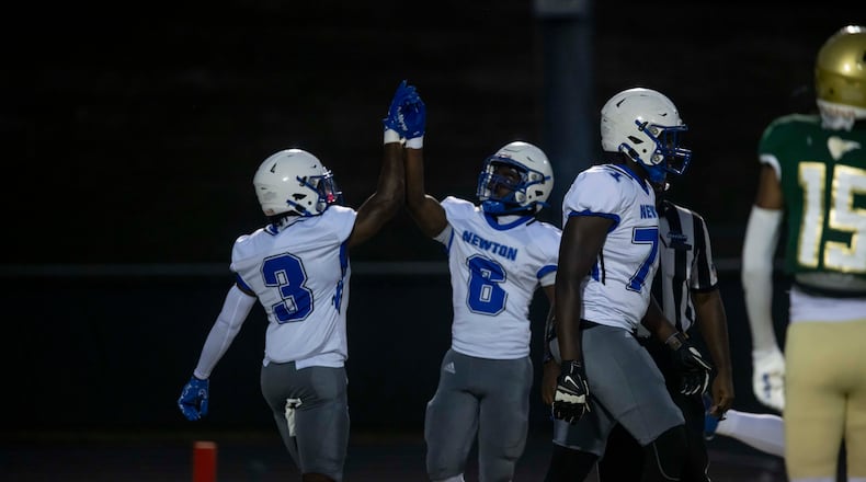 Newton County players celebrate a touchdown during Friday's game against Grayson. (Photo/Jenn Finch)