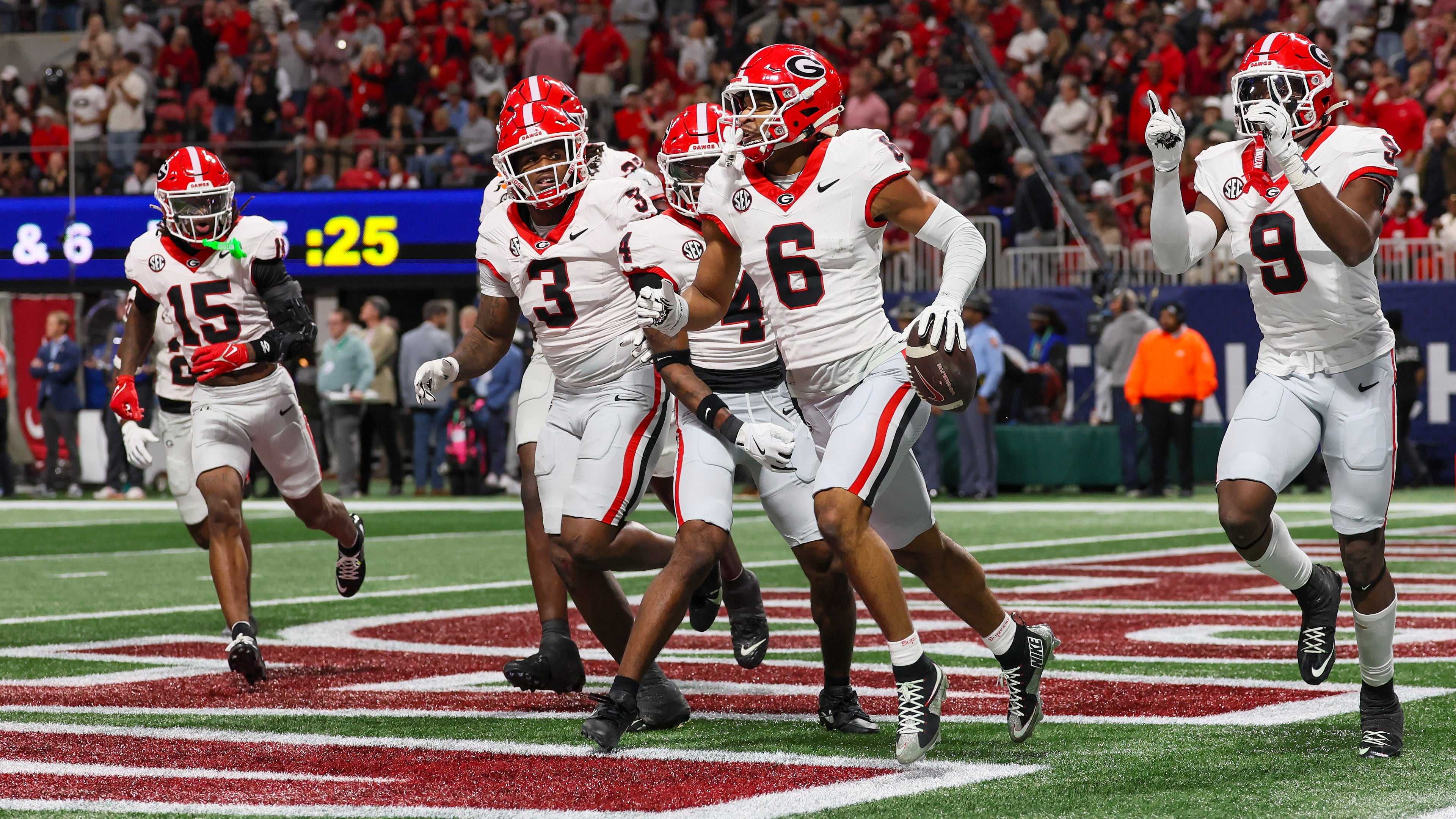 Georgia's win over Alabama in the SEC Championship Game has secured a likely No. 2 or No. 3 seed in the upcoming College Football Playoff, giving the Bulldogs a first-round bye. (Jason Getz/AJC)