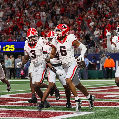 Georgia defensive back Daylen Everette (6) celebrates with teammates after an interception against Alabama during the first quarter of the SEC Championship game at Mercedes-Benz Stadium, Saturday, Dec. 6, 2025, in Atlanta. (Jason Getz / AJC)