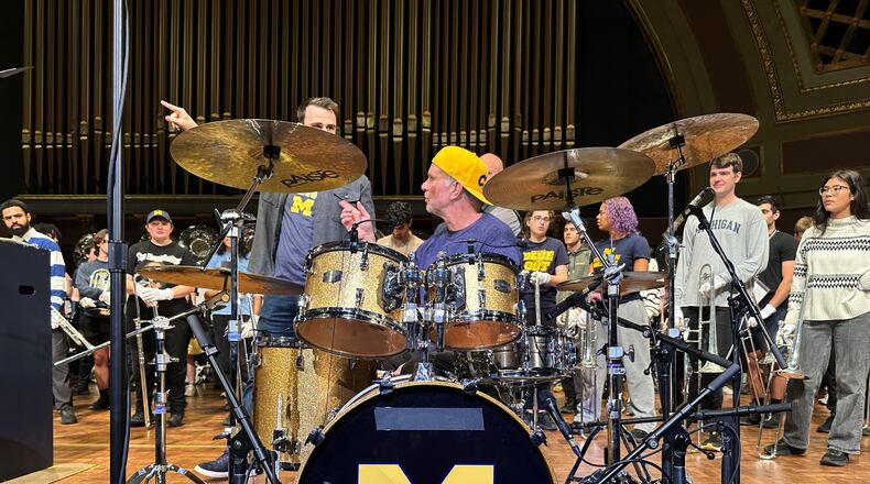 Red Hot Chili Peppers drummer Chad Smith performs with the Michigan Marching Band in Hill Auditorium on the campus of the University of Michigan Sunday, Nov. 2, 2025, in Ann Arbor, Mich. (AP Photo/Mike Householder)