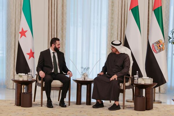 This photo released by the official Syrian news agency SANA, shows United Arab Emirates President Sheikh Mohammed bin Zayed Al Nahyan, right, meeting with Syrian President Ahmad al-Sharaa in Abu Dhabi, United Arab Emirates, Sunday, April 13, 2025. (SANA via AP)