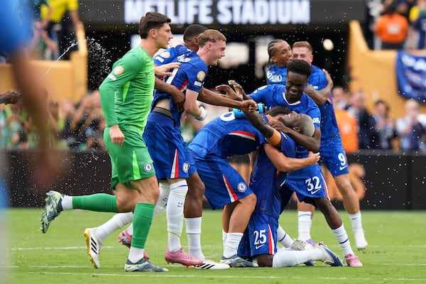 Chelsea players celebrate after winning the Club World Cup final soccer match against Paris Saint-Germain in East Rutherford, N.J., Sunday, July 13, 2025. (AP Photo/Frank Franklin II)