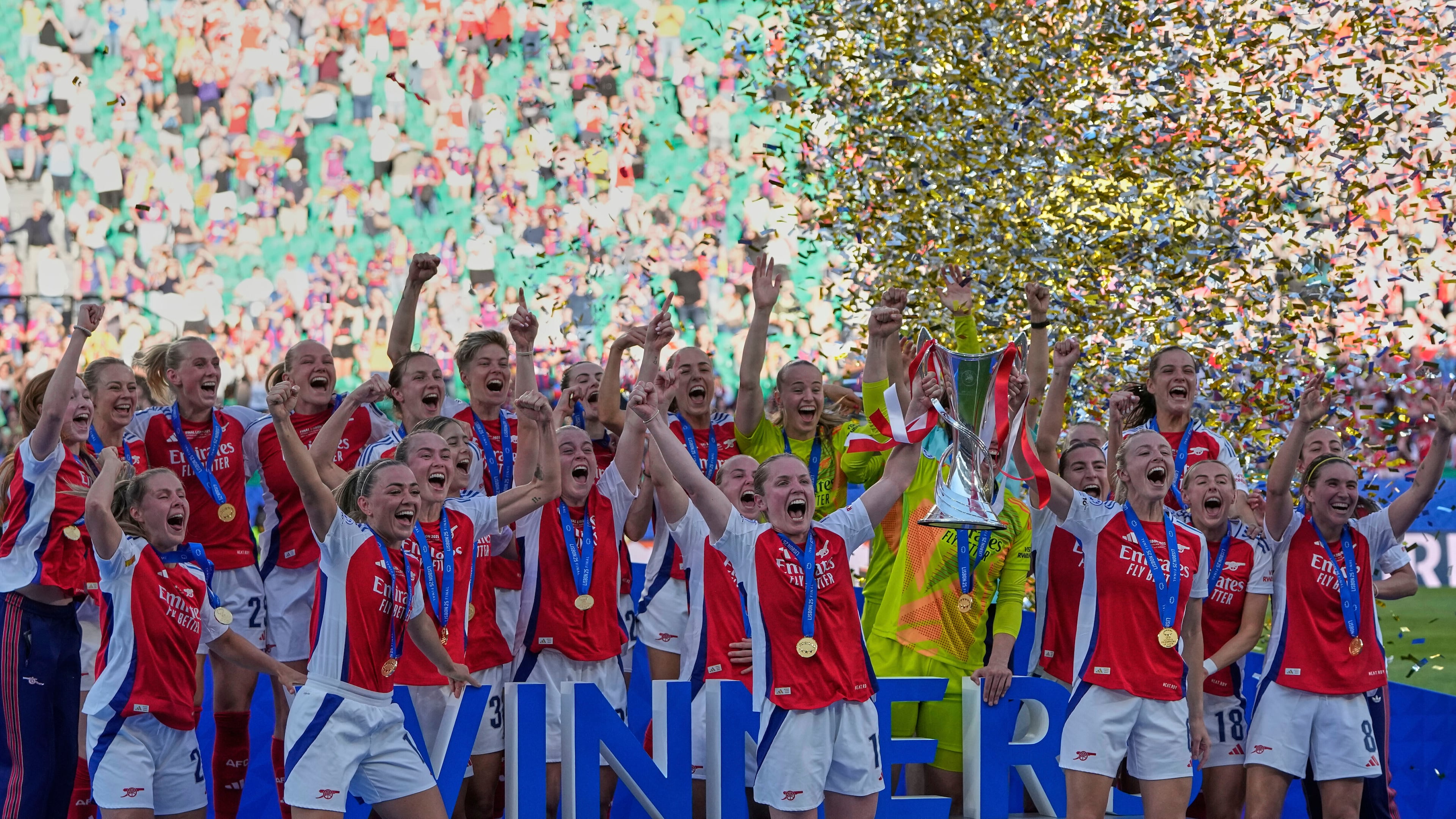 FILE - Arsenal players celebrate with their trophy after winning the women's Champions League final soccer match between Arsenal and FC Barcelona at the Jose Alvalade stadium in Lisbon, Saturday, May 24, 2025. (AP Photo/Armando Franca, File)