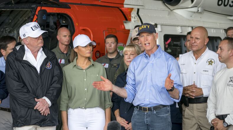 President Donald Trump receives a briefing from Gov. Rick Scott on Hurricane Irma relief efforts in Ft. Myers, Fla., Sept. 14, 2017. Eleven elderly people died from heat-related causes after their nursing home lost power. DOUG MILLS / THE NEW YORK TIMES