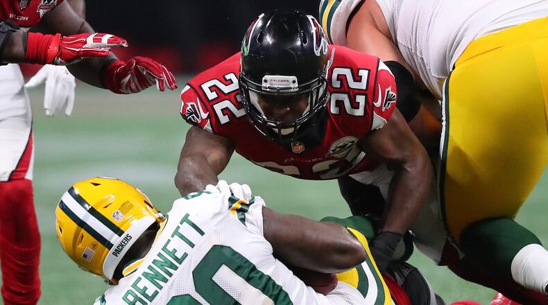 September 17, 2017 Atlanta: Falcons safety Keanu Neal body slams Packers tight end Martellus Bennett for the stop during the second half in a NFL football game on Sunday, September 17, 2017, in Atlanta.    Curtis Compton/ccompton@ajc.com