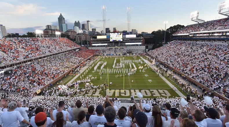 Georgia Tech’s Ramblin’ Wreck leads the band, cheerleaders, Buzz, players, and coaches before the start of the Georgia Tech home game against the Clemson Tigers at Bobby Dodd Stadium on Thursday, September 22, 2016. HYOSUB SHIN / HSHIN@AJC.COM