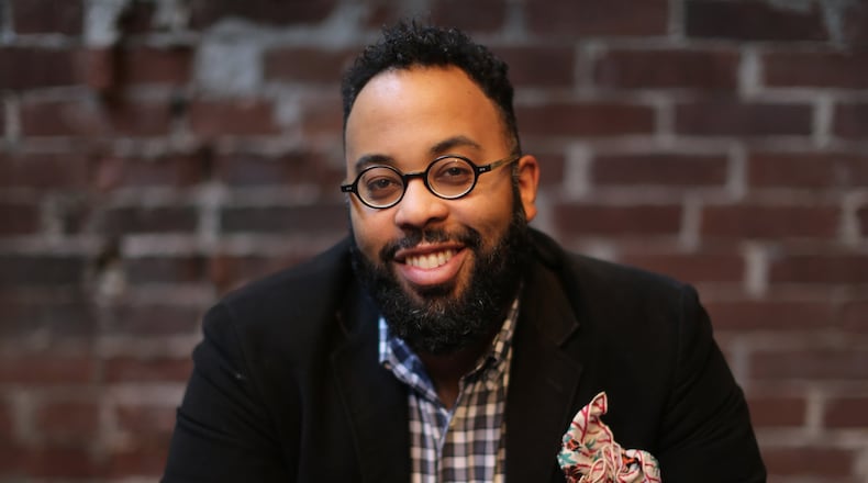 February 8, 2016 Atlanta: Atlanta poet and Emory professor Kevin Young, shown at Ticonderoga Club in the Krog Street Market, is the author of “Blue Laws: Selected and Uncollected Poems, 1995-2015.” Ben Gray / bgray@ajc.com
