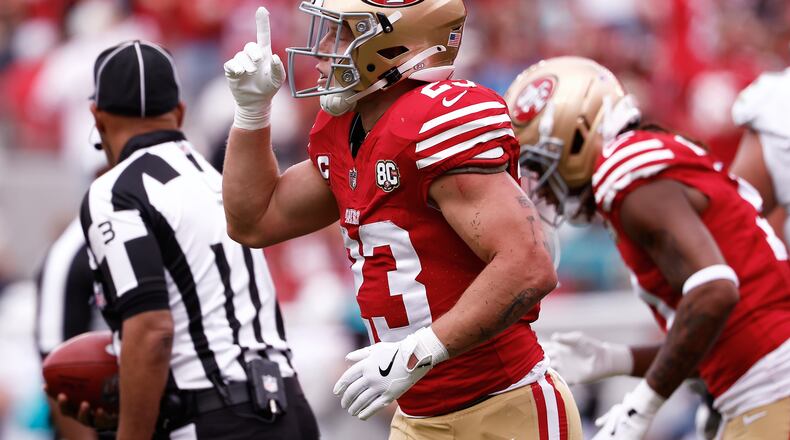 San Francisco 49ers running back Christian McCaffrey celebrates after scoring against the Miami Dolphins during the first half of an NFL football game in Santa Clara, Calif., Sunday, Sept. 20, 2026. (AP Photo/Kelley L. Cox)