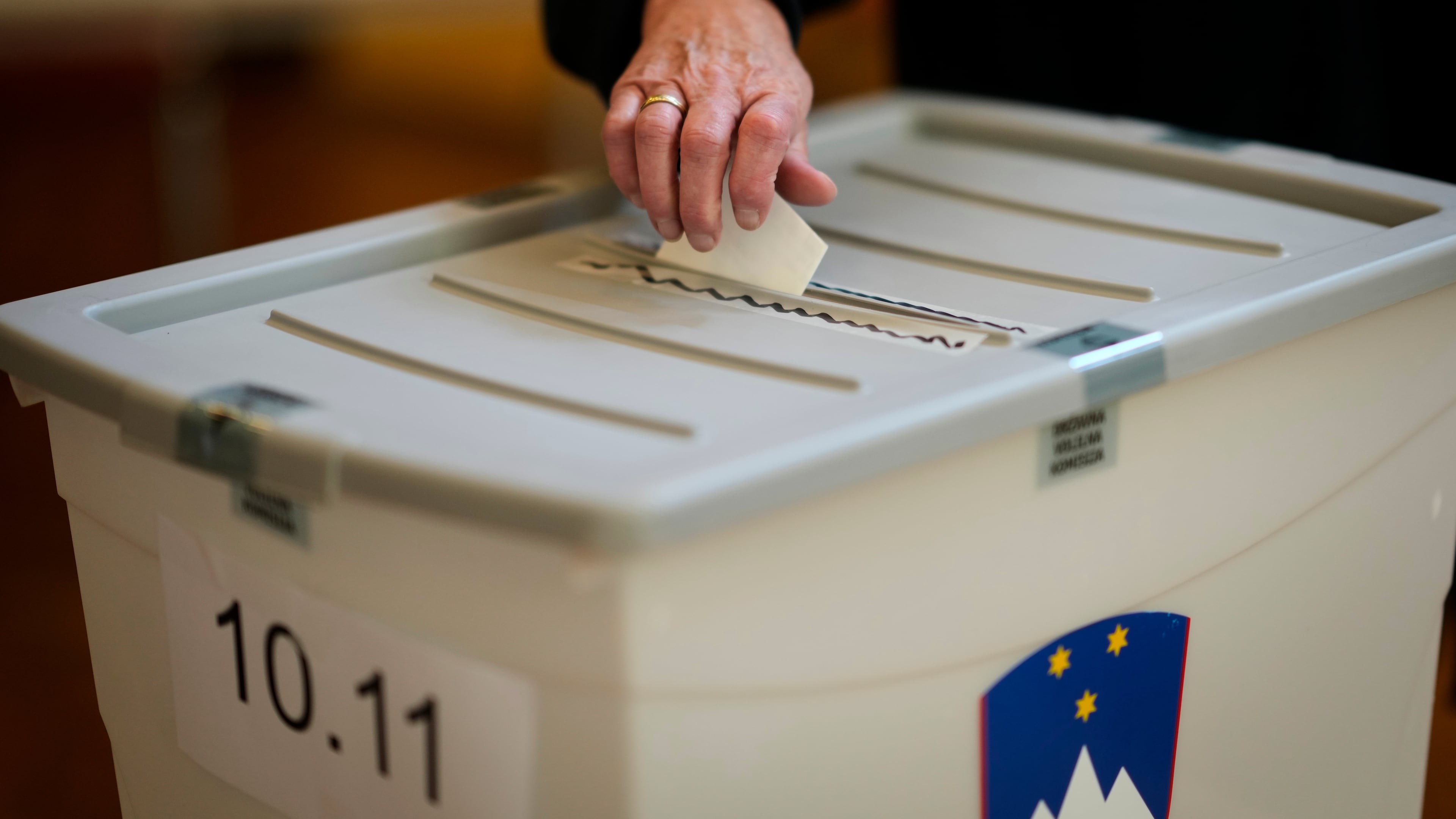 A voter casts her ballot at a polling station during the referendum on assisted dying for terminally ill patients, in Domzale, Slovenia, Sunday, Nov. 23, 2025. (AP Photo/Darko Bandic)