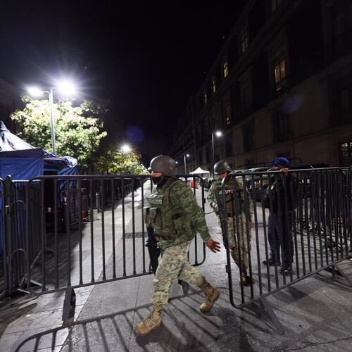 Army soldiers patrol outside the National Palace ahead of the daily, morning news conference by Mexican President Claudia Sheinbaum in Mexico City, Monday, Feb. 23, 2026. (AP Photo/Ginnette Riquelme)