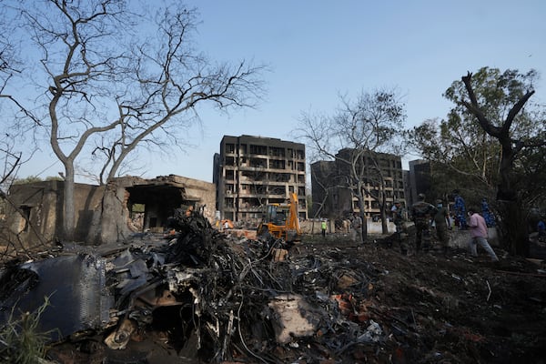 Rescuers work at the site of an airplane that crashed in India's northwestern city of Ahmedabad in Gujarat state, Thursday, June 12, 2025. (AP Photo/Ajit Solanki)