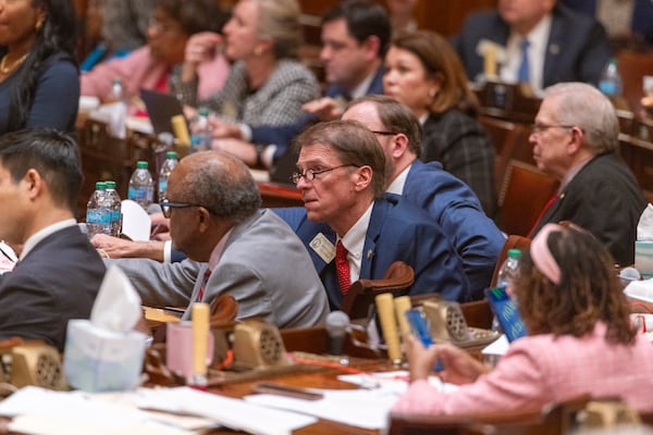 State representatives, including Rep. Spencer Frye, D-Athens, vote on legislation at the Capitol in Atlanta last week. (Arvin Temkar/AJC)