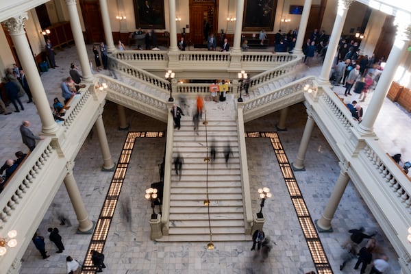 People make their way through the State Capitol during Crossover Day last week. (Ben Gray for the AJC)