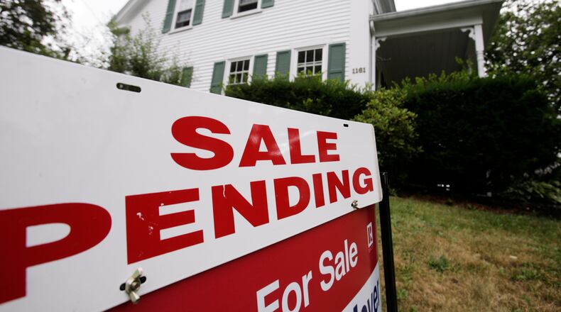 FILE - In this July 26, 2011 photo, a sale pending sign is posted outside a house in Bath, Maine. (AP Photo/Pat Wellenbach, File)