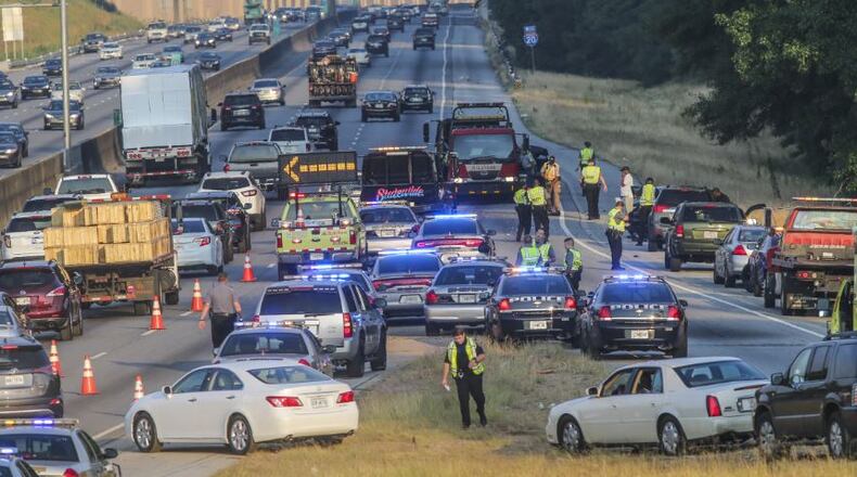 Police arrested three men in a Honda Accord after a chase resulted in three hit-and-run accidents Tuesday morning. They are seeking a fourth man who fled. JOHN SPINK / JSPINK@AJC.COM