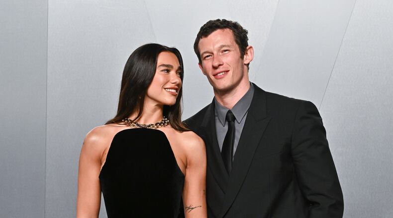 FILE - Dua Lipa, left, and Callum Turner arrive at the Vanity Fair Oscar Party on Sunday, March 15, 2026, at the Los Angeles County Museum of Art in Los Angeles. (Photo by Evan Agostini/Invision/AP, File)