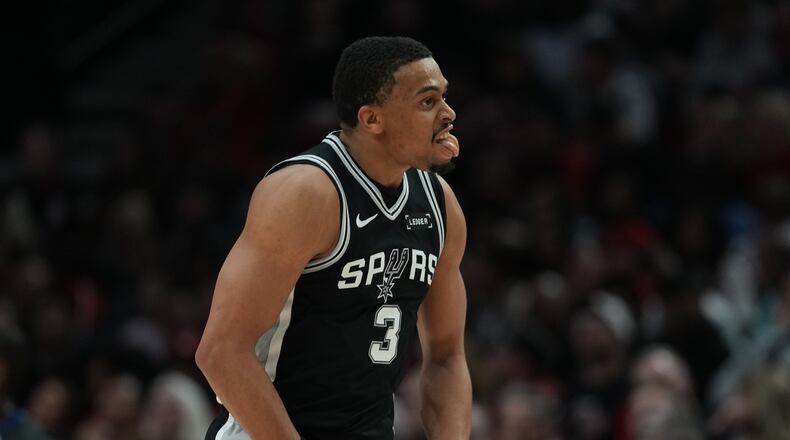 San Antonio Spurs forward Keldon Johnson (3) reacts after scoring against the Portland Trail Blazers during the second half in Game 3 of a first-round NBA playoffs basketball series in Portland, Ore, Friday, April 24, 2026. (AP Photo/Jenny Kane)