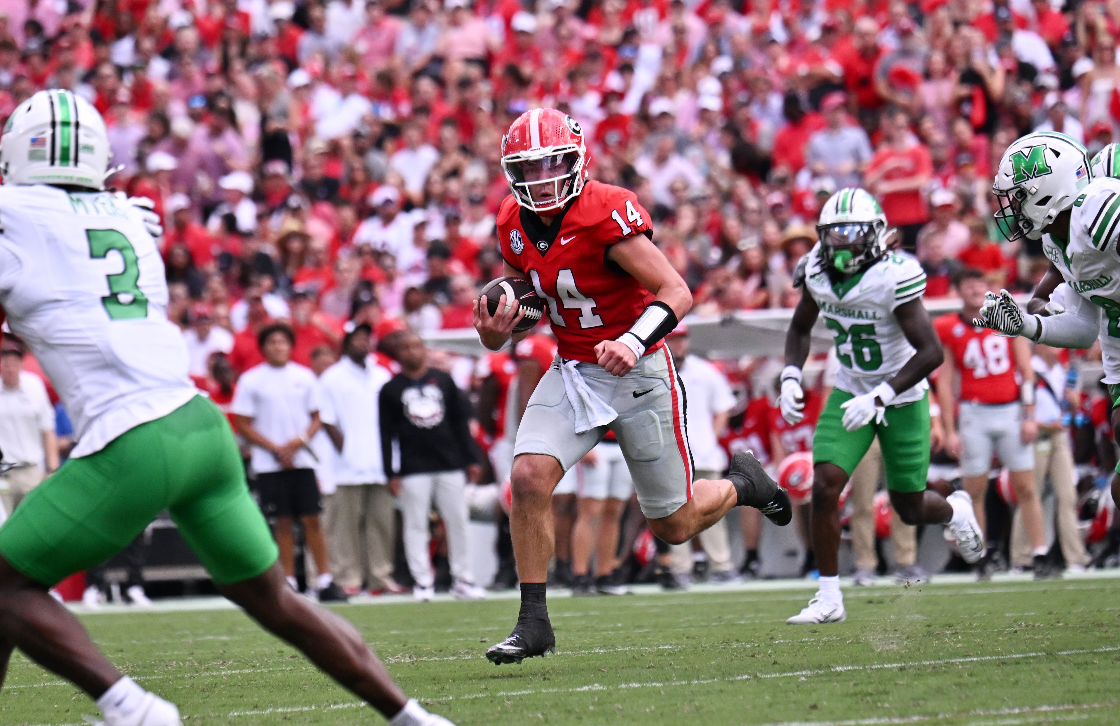 Georgia quarterback Gunner Stockton (14) runs with the ball during the first half in an NCAA football game at Sanford Stadium, Saturday, August 30, 2025, in Athens. (Hyosub Shin / AJC)