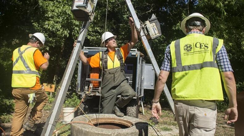 Contractors for Compliance Envirosystems do work on DeKalb County's sewer system in 2017.