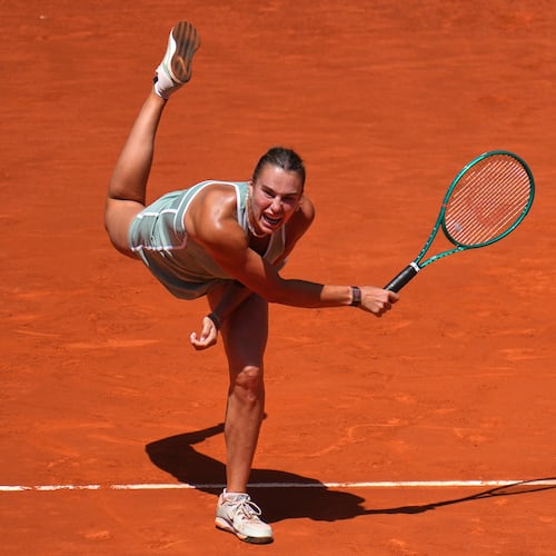 Aryna Sabalenka of Belarus serves the ball to Naomi Osaka of Japan during the Madrid Open tennis tournament in Madrid, Monday, April 27, 2026. (AP Photo/Manu Fernandez)