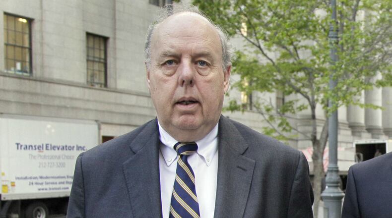 In this April 29, 20111, file photo, attorney John Dowd walks in New York.