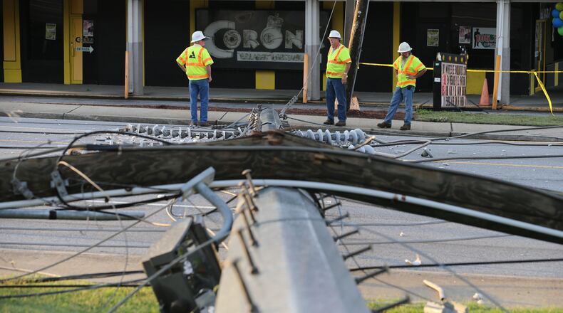 A major Gwinnett County road was blocked this morning after a huge power pole fell across the roadway. The metal utility pole came down onto Singleton Road before 6:30 a.m., blocking all lanes in both directions between Jimmy Carter Boulevard and Thompson Parkway. JOHN SPINK/JSPINK@AJC.COM