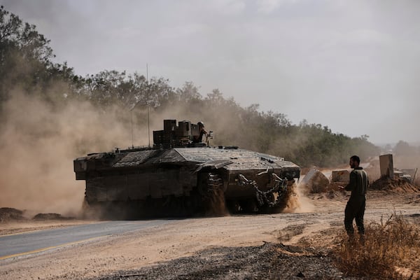 Israeli forces move along the border with the Gaza Strip, in southern Israel, Monday, May 19, 2025. (AP Photo/Ohad Zwigenberg)