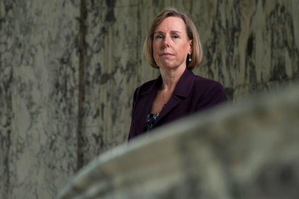 Mary Wearn, president of Georgia Humanities, poses for a portrait in the rotunda of the historic Hurt building where their offices are located in Atlanta, Wednesday, April 9, 2025. (AP Photo/Ben Gray)