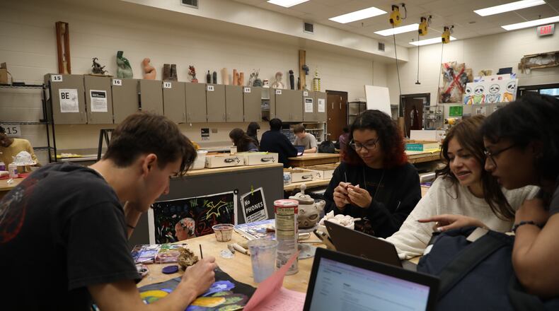 Art students at Brookwood High in Snellville work in a variety of media with the latest technological tools. Courtesy