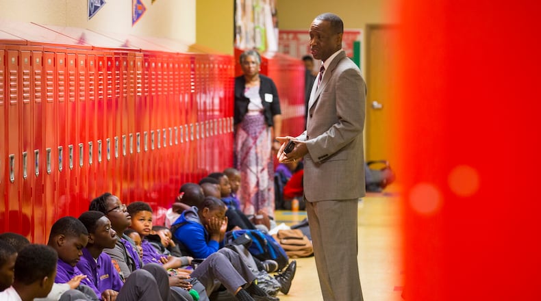 Genesis Innovation Academy founder Gavin A. Samms (center) leads a morning affirmation session in the boys building at the campus in Atlanta, Friday, May 11, 2018. ALYSSA POINTER/ALYSSA.POINTER@AJC.COM