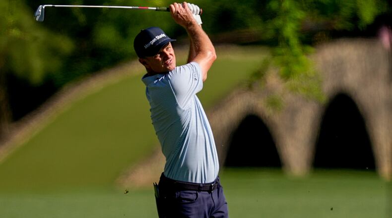 Justin Rose, of England, hits from the fairway on the 13th hole during the first round of the Masters golf tournament at the Augusta National Golf Club, Thursday, April 9, 2026, in Augusta, Ga. (AP Photo/David J. Phillip)