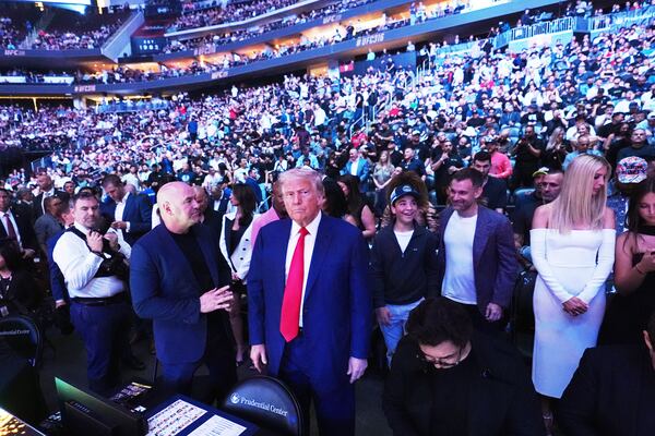 President Donald Trump attends the UFC-316 mixed martial arts event, at the Prudential Center, Saturday, June 7, 2025, in Newark, N.J., as UFC's Dana White, looks on. (AP Photo/Frank Franklin II)