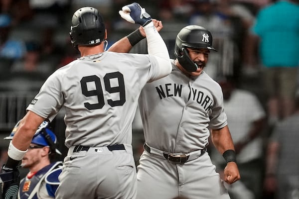 New York Yankees' Trent Grisham (12) celebrates his grand slam home run against the Atlanta Braves in the ninth inning of a baseball game, Saturday, July 19, 2025, in Atlanta. (AP Photo/Mike Stewart)