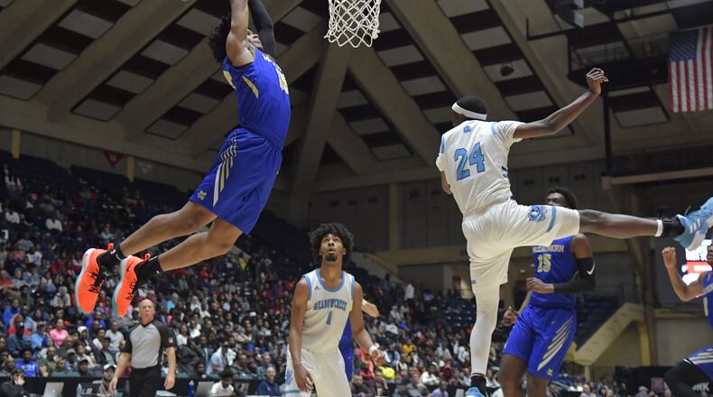 March 9, 2019 Macon - McEachern Isaac Okoro (35) ducks the ball against Meadowcreek in GHSA State Basketball Championship game at the Macon Centreplex in Macon on Saturday, March 9, 2019. McEachern won 62-54 over the Meadowcreek. HYOSUB SHIN / HSHIN@AJC.COM
