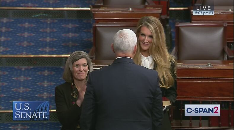 U.S. Sen. Joni Ernst of Iowa observes as U.S. Sen. Kelly Loeffler of Georgia is sworn into office by Vice President Mike Pence. Photo courtesy of C-SPAN.