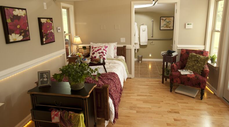 The MEDCottage has a handicapped-accessible bathroom and a ceiling track system that allows a lift or hook to be installed, which can provide more stability for the resident when walking.Credit: MedCare Systems. H