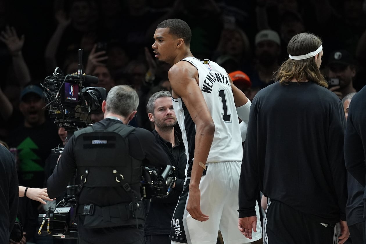 San Antonio Spurs forward Victor Wembanyama (1) reacts after he was ejected for a flagrant foul during the first half of Game 4 of a NBA basketball second-round playoff series against the Minnesota Timberwolves in Minneapolis, Sunday, May 10, 2026. (AP Photo/Abbie Parr)