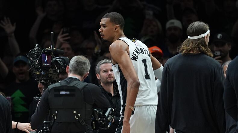 San Antonio Spurs forward Victor Wembanyama (1) reacts after he was ejected for a flagrant foul during the first half of Game 4 of a NBA basketball second-round playoff series against the Minnesota Timberwolves in Minneapolis, Sunday, May 10, 2026. (AP Photo/Abbie Parr)