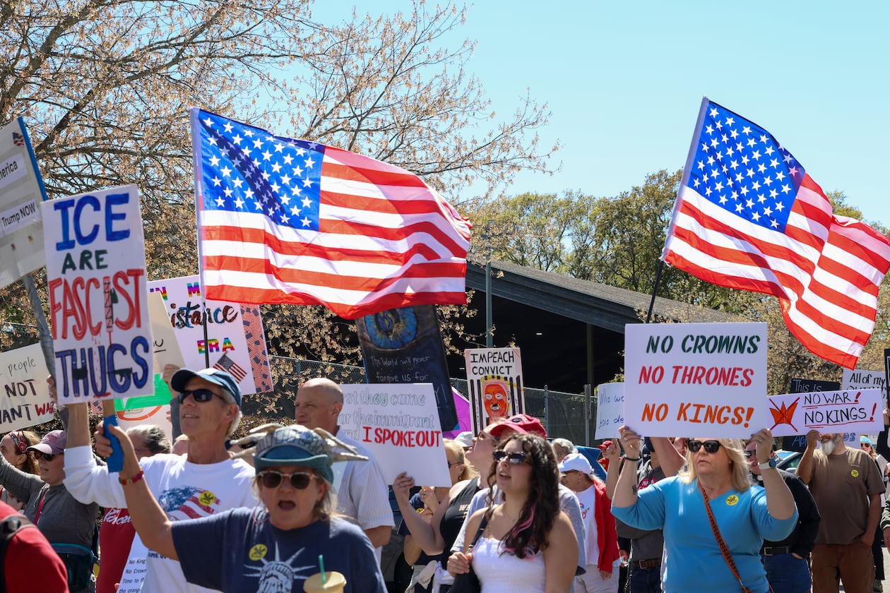 People march in Bishop Park in Athens on Saturday, March 28, 2026. Protesters gathered in 10 different locations around Georgia’s Congressional District 10, leading up to a “Democracy Fair” at Bishop Park as part of a nationwide day of “No Kings” demonstrations. Organizers estimate that a few thousand people participated, many of them first-time protesters. (C.J. Bartunek for the AJC)